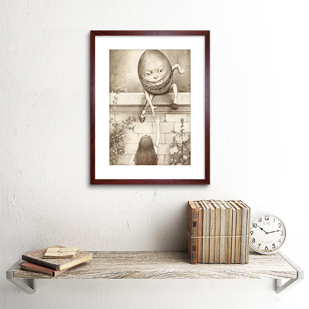 framed photo on a wall with cherry wood frame